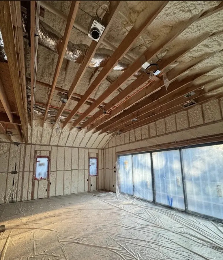 Interior walls and ceiling insulated with spray foam during new construction in Carroll